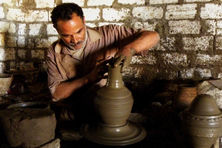 Egyptian potter with vase on wheel
