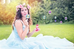 pretty woman blowing bubbles